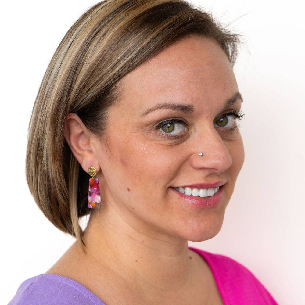 Woman wearing Mia Mini drop earrings in Paradise Pink with gold hammered studs.