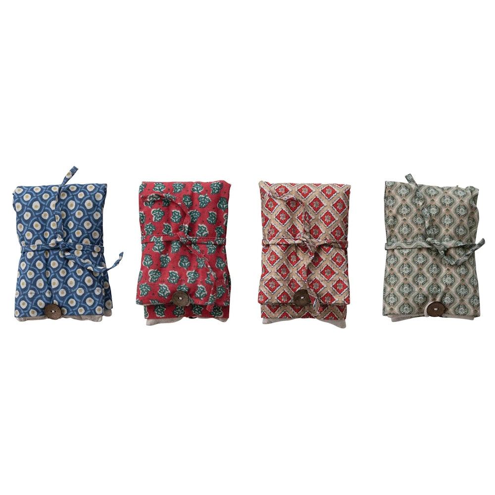 Four patterned microwaveable hot and cold packs filled with lavender and lentils for natural pain relief.
