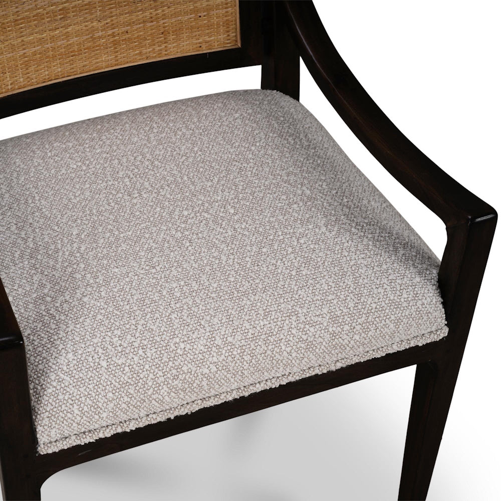 Milano dining chair with upholstered fabric seat cushion and dark wood frame close up.