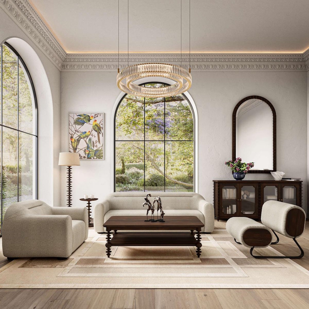 Modern luxury living room with beige sofas, a wooden coffee table, and a large crystal chandelier.