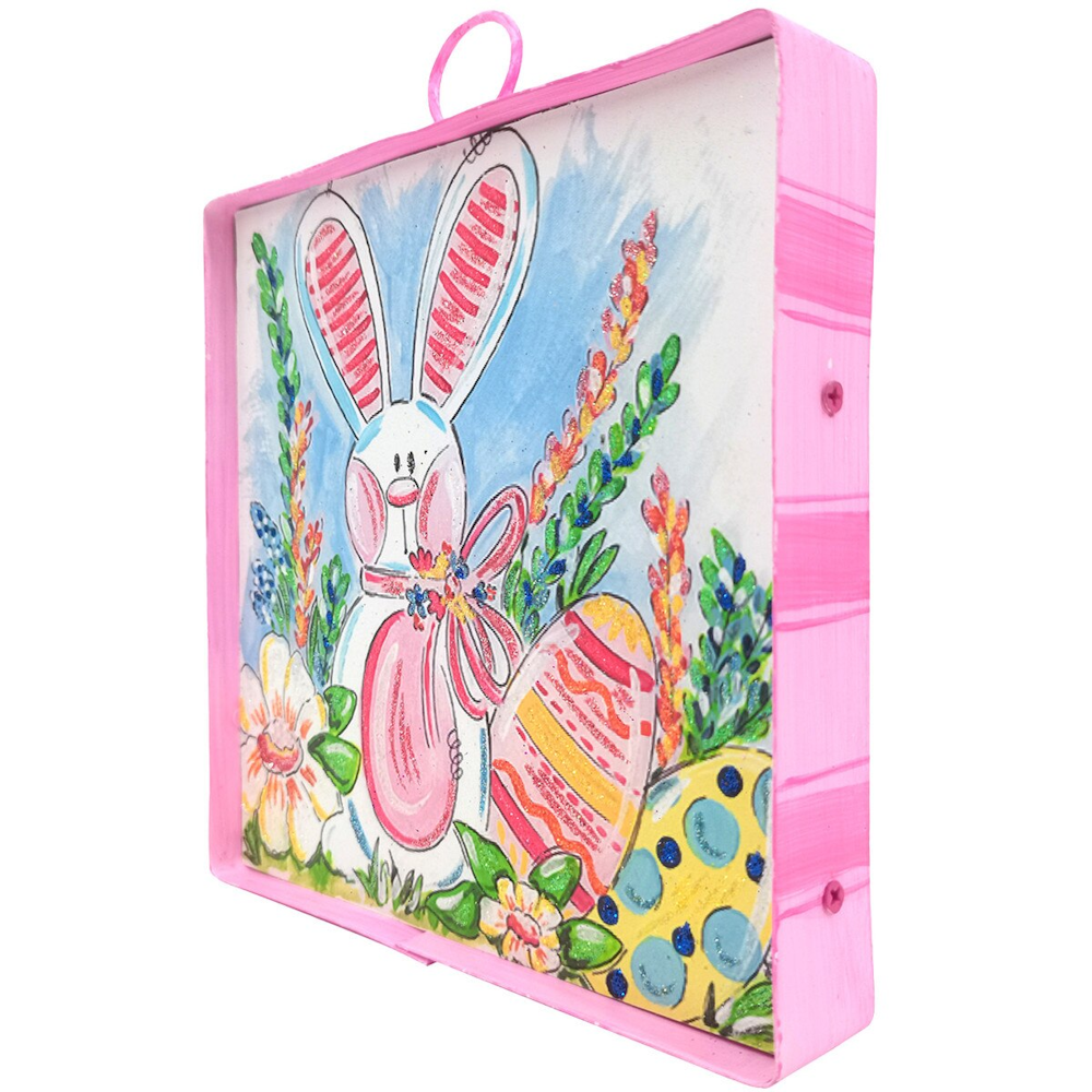 Pink metal frame housing a colorful illustration of an Easter bunny, decorative eggs, and vibrant spring flowers.