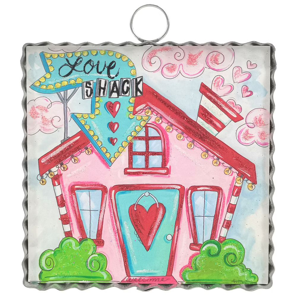 Whimsical Love Shack wall art in a ruffled metal frame, featuring a pink house, teal retro sign, and heart accents.