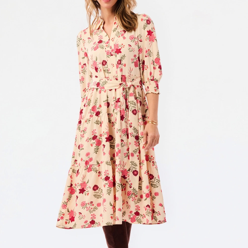 Cream tiered midi dress with pink and red floral print, V-neckline, tie waist, and three-quarter sleeves.