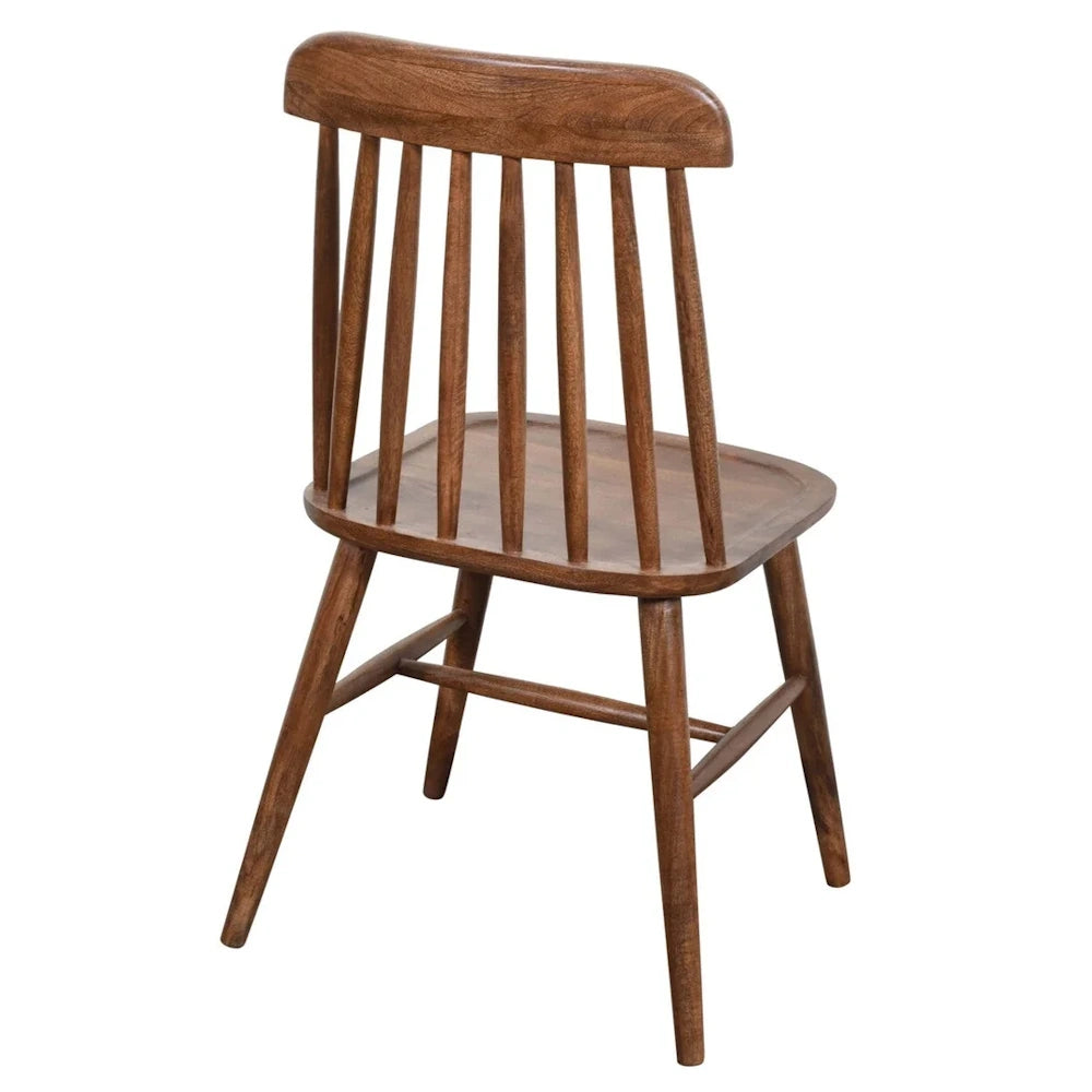 Mid-century modern walnut brown spindle back wood dining chair on white background.