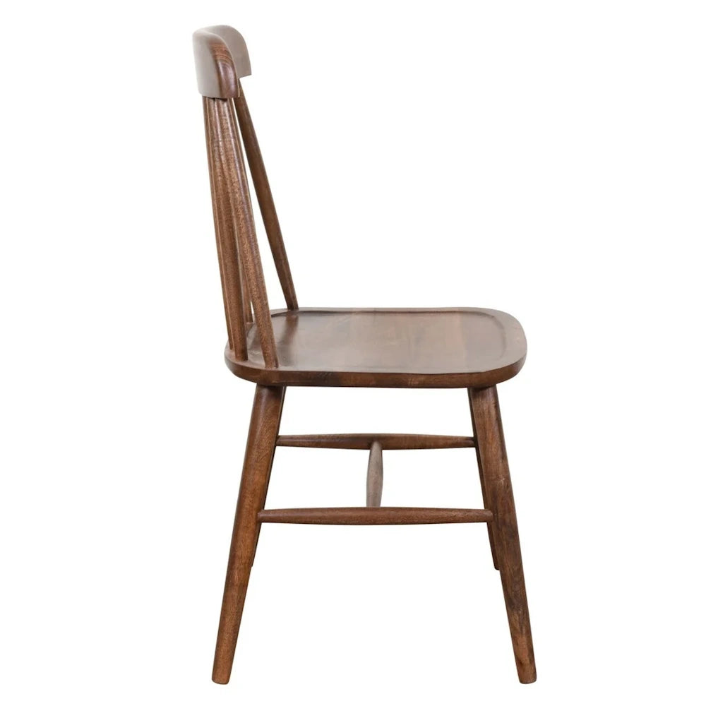 Mid-century modern walnut dining chair with spindle back, side profile view on white background.