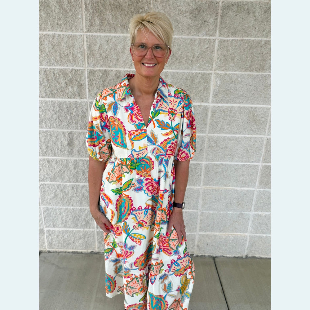 Colorful paisley print maxi dress with puff sleeves and v-neck.