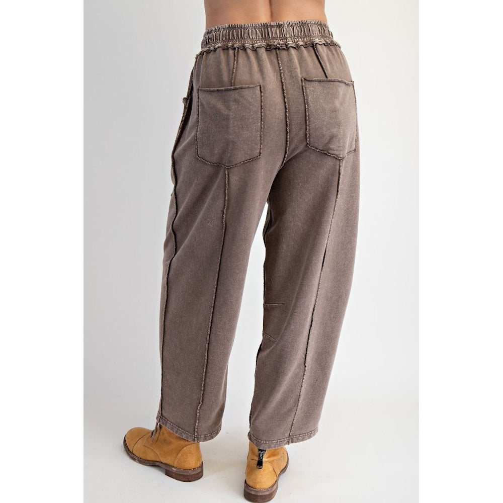 Back view of mocha mineral-washed terry knit barrel-leg pants with elastic waist and back patch pockets.
