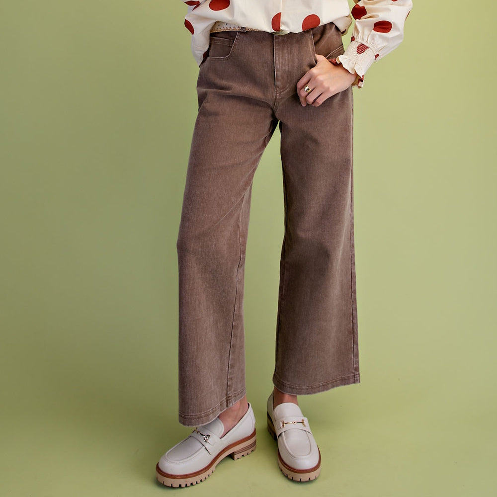 Person wearing mocha brown washed wide-leg twill pants with cream lug-sole loafers.