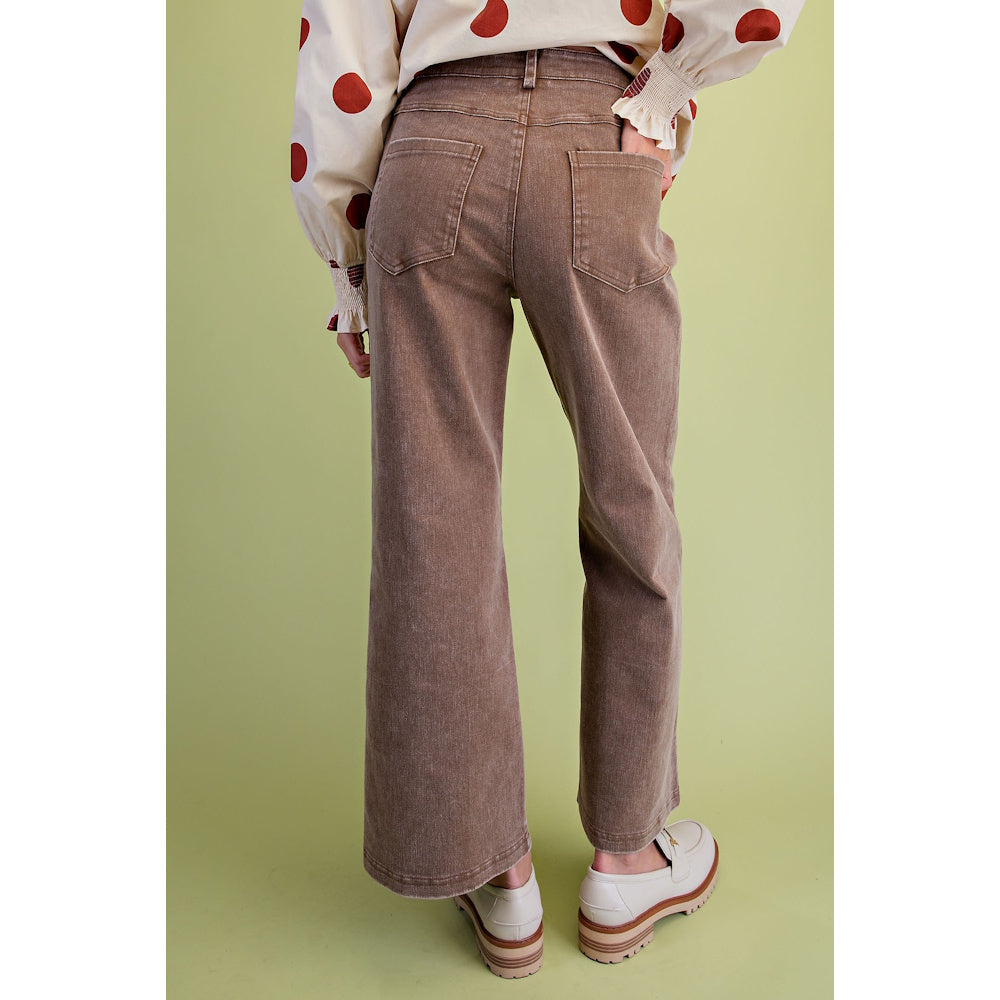 Back view of mocha brown washed wide-leg twill pants with back pockets and white loafers.