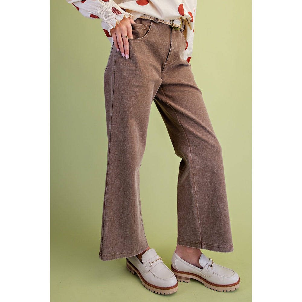 Side angle view of mocha brown washed wide-leg twill pants paired with cream loafers.