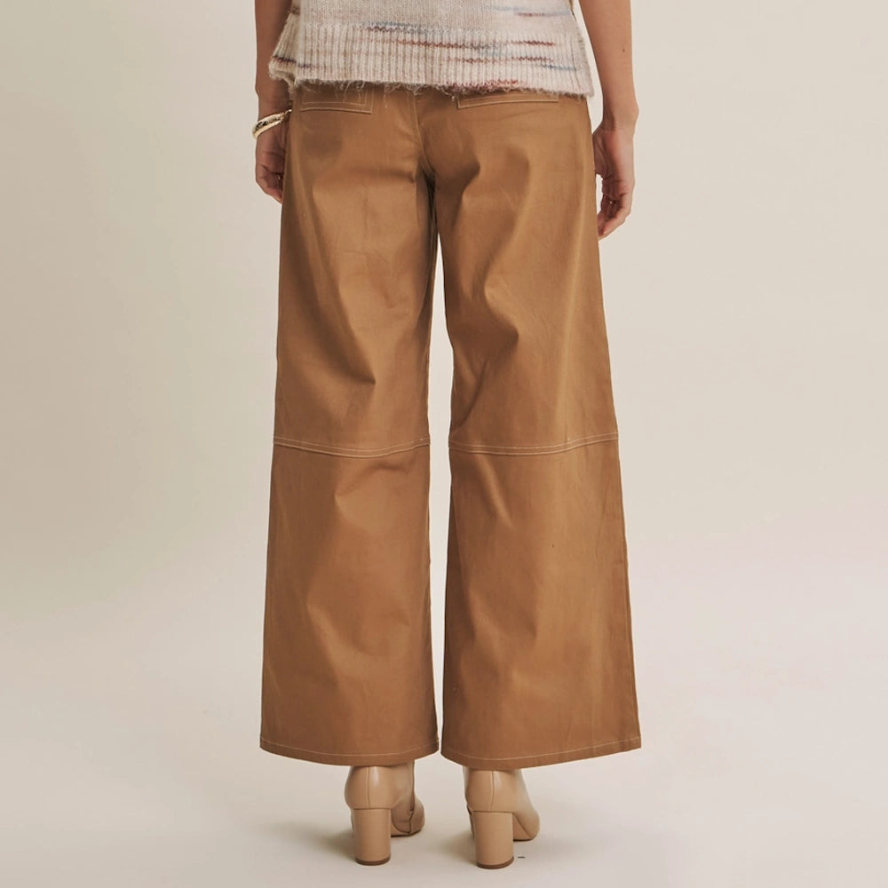 Back view of camel wide-leg cotton twill pants with contrast white stitching and welt rear pockets.