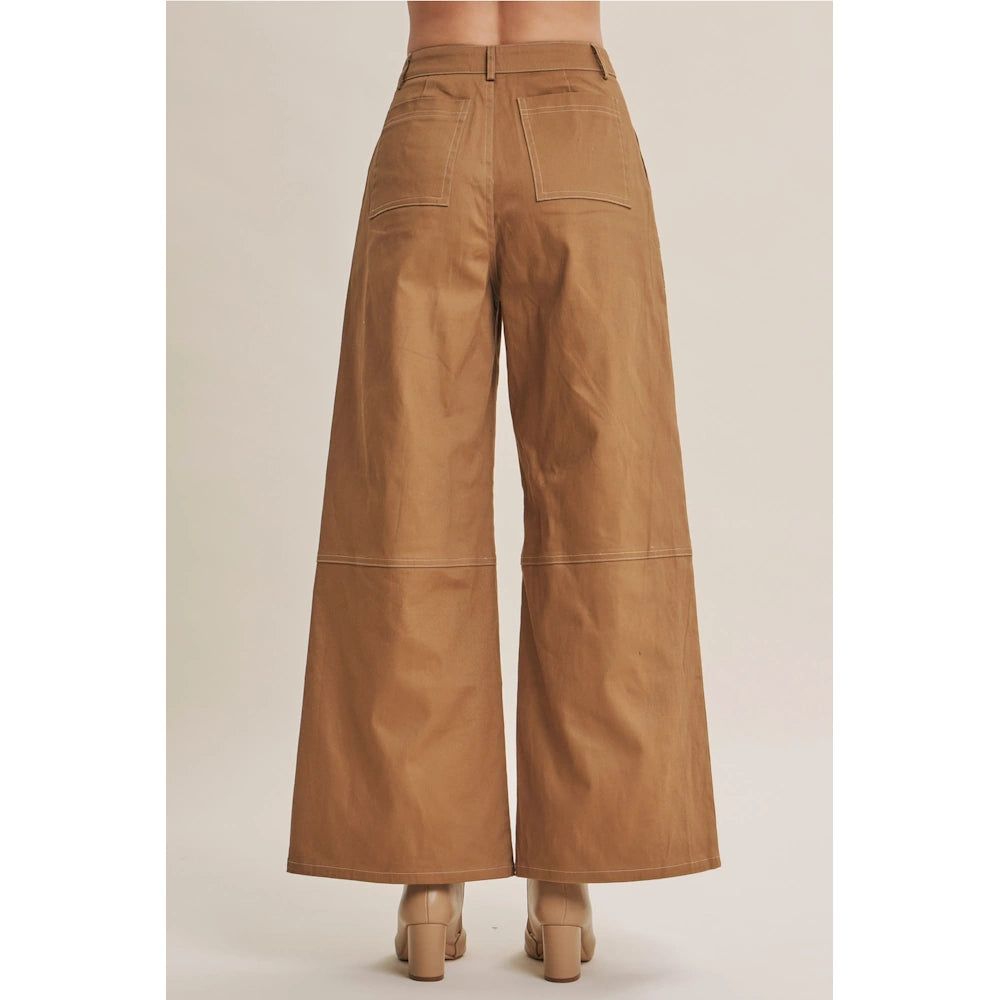 Back view of camel wide-leg cotton twill pants showing white contrast stitching and patch pockets.