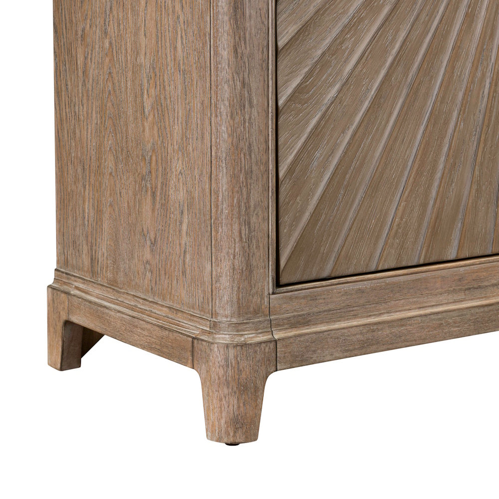 Close-up of the wooden cabinet base, showing the tapered leg and fluted corner detail.