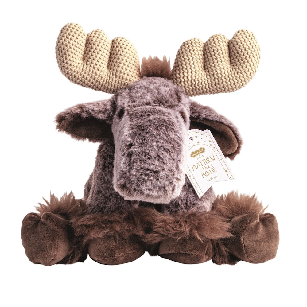 Brown plush moose toy sitting upright with large knit-textured antlers and a gift tag attached.