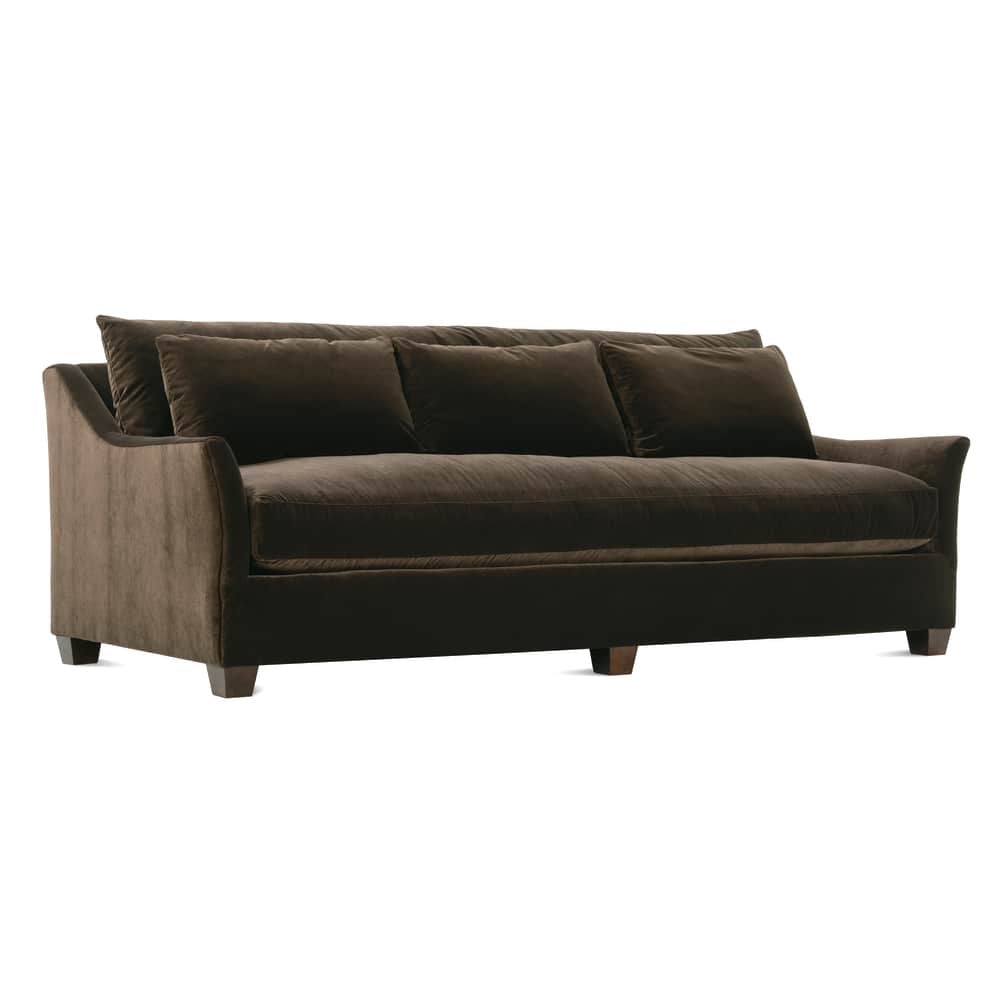 Brown velvet sofa with plush cushions and wooden legs on a white background.