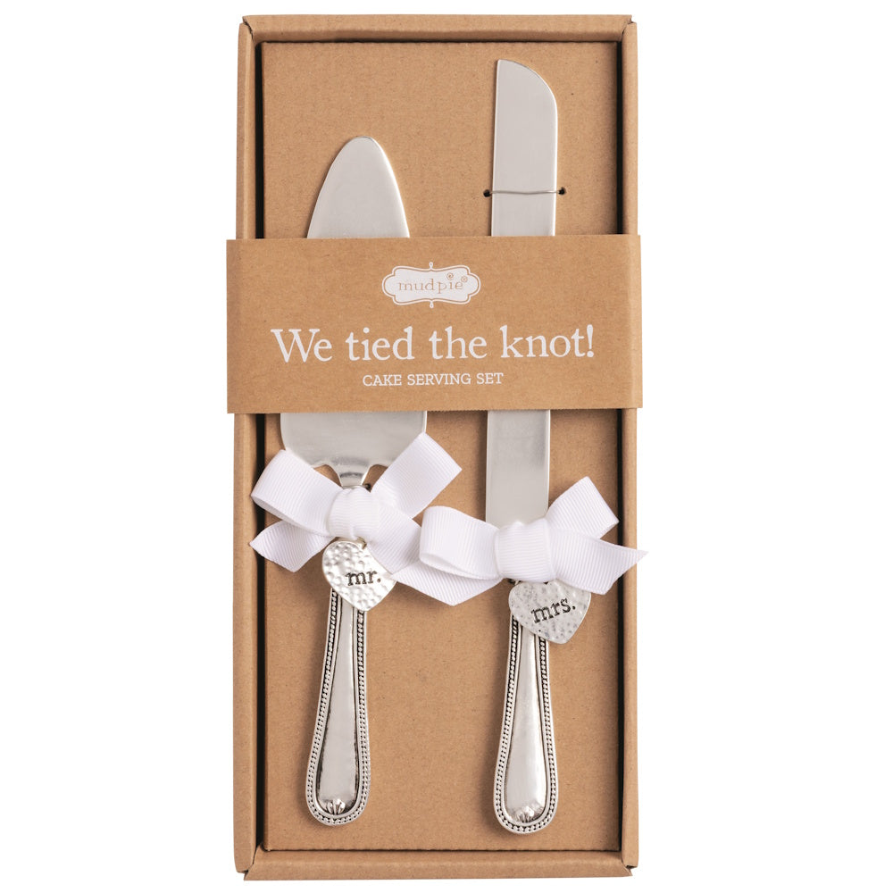 Mud Pie wedding cake serving set in a box with "Mr." and "Mrs." heart charms and white bows on the silver handles.