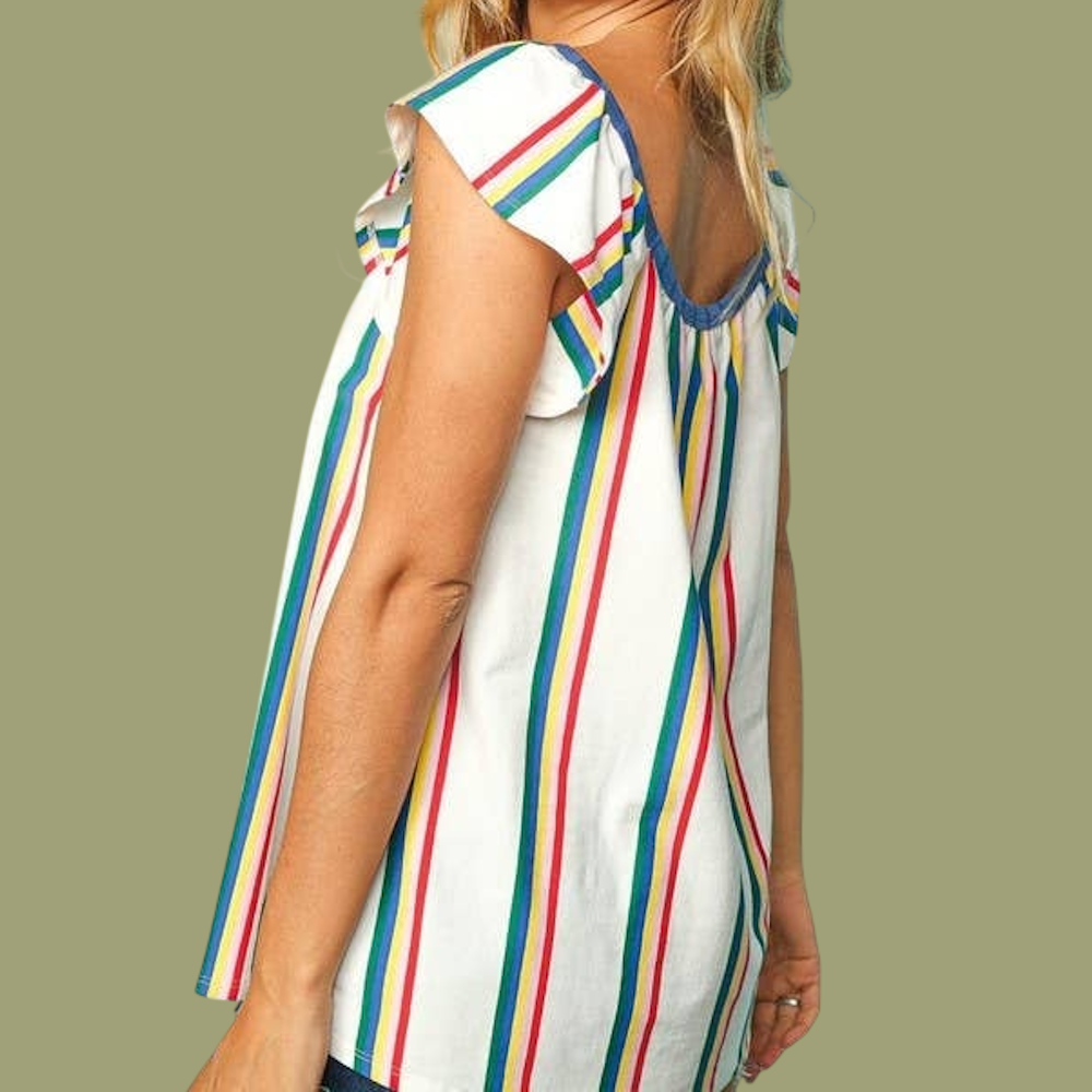 Side view of a white sleeveless top with primary-colored vertical stripes and ruffle details.