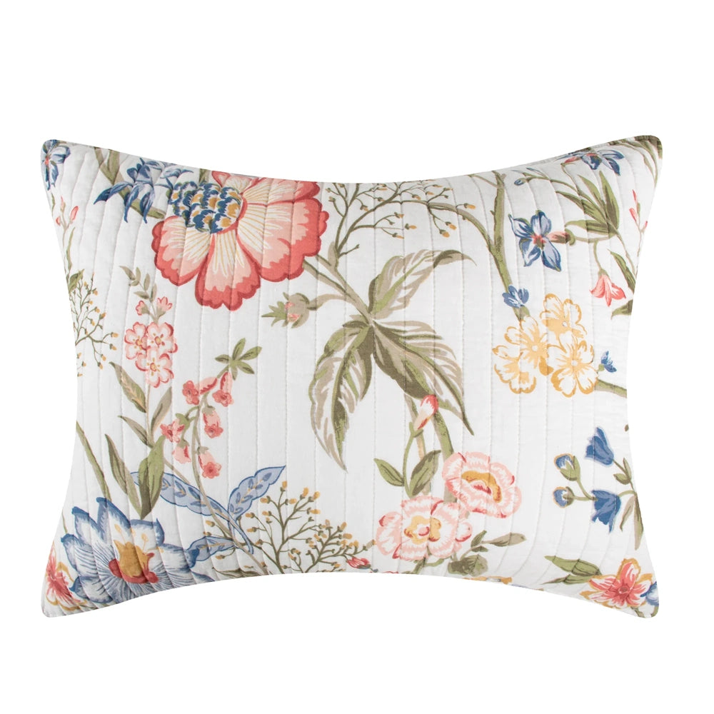 Quilted pillow sham featuring a colorful botanical floral print in shades of pink, yellow, blue, and green.