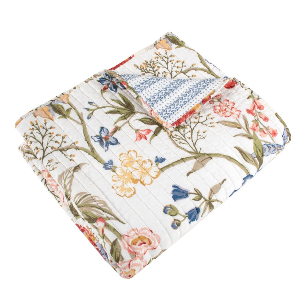 Multicolor floral Maileen quilted throw blanket with reversible blue pattern.
