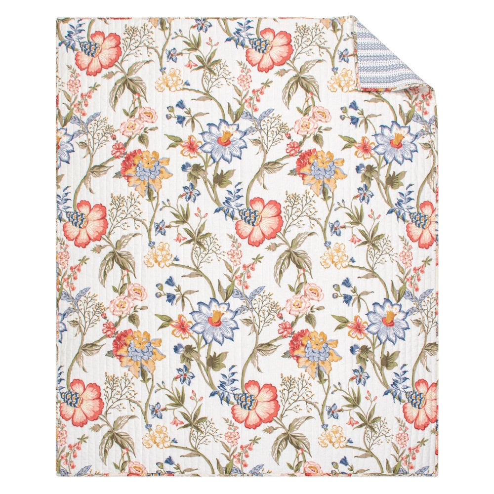 Multicolor Maileen quilted throw blanket with a vintage floral pattern and a blue striped reverse side.
