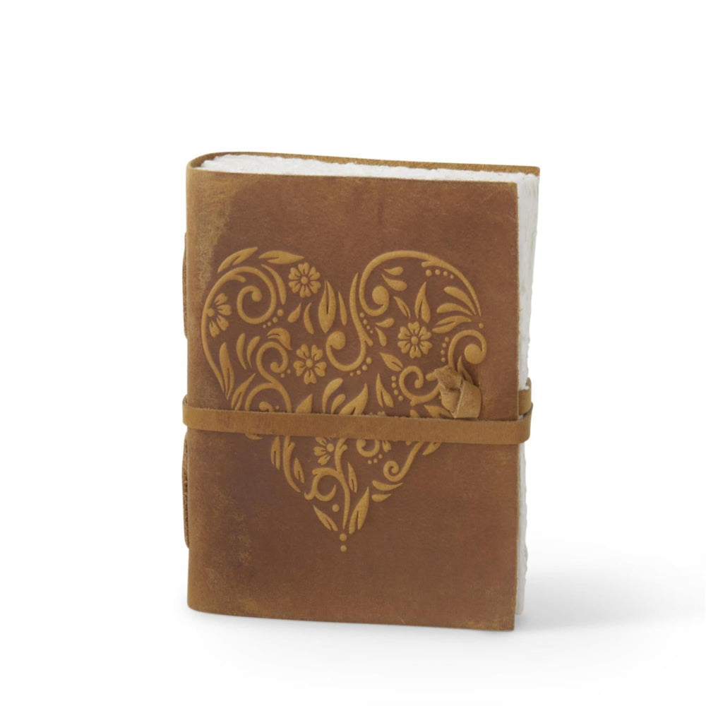 Handcrafted mustard leather journal with a floral embossed heart, deckle edge paper, and a matching wrap-around tie.