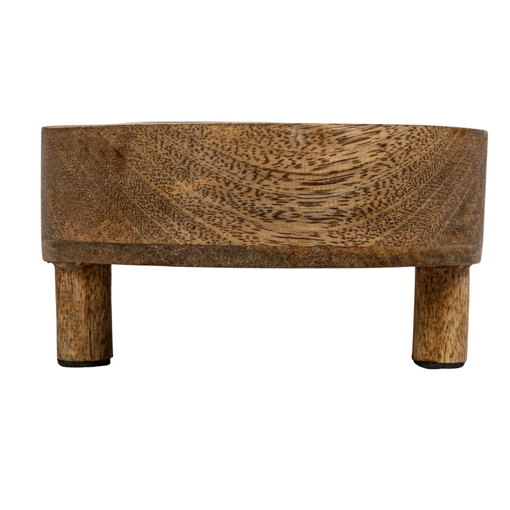Round natural mango wood footed tray riser with short legs.