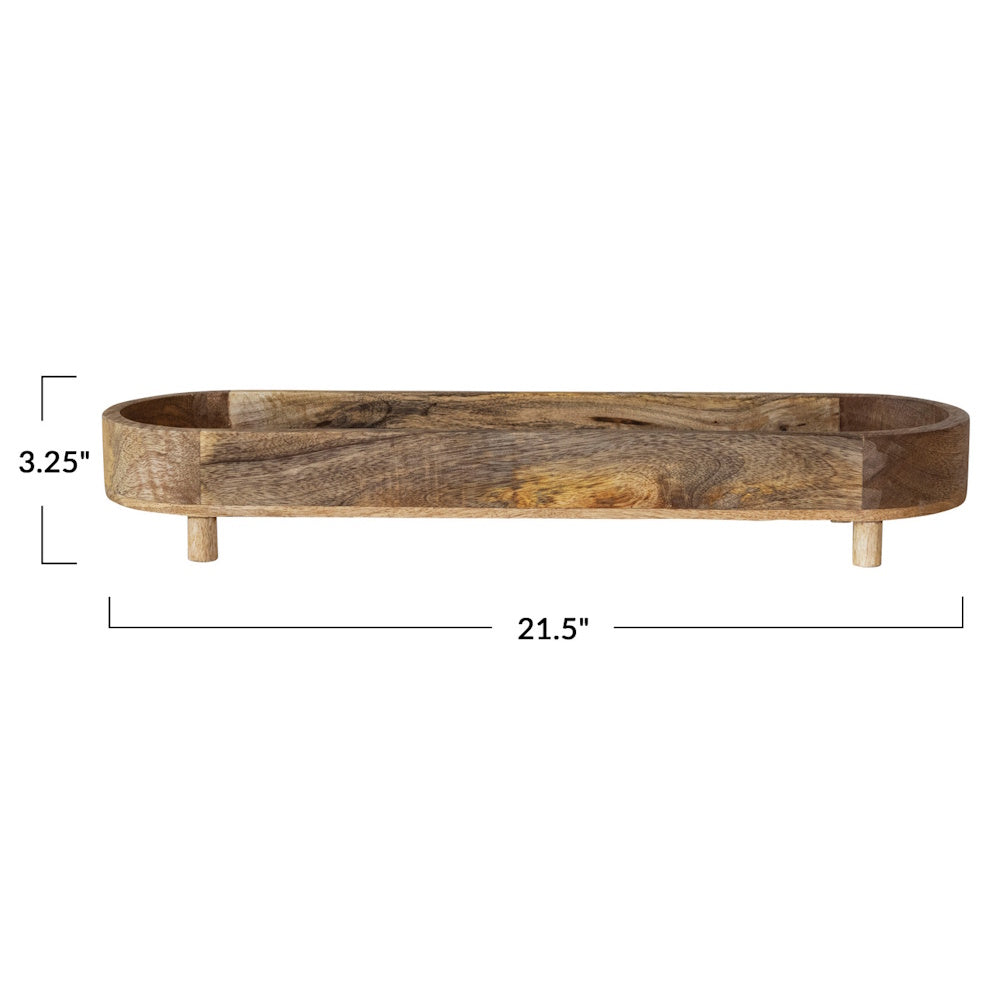 Natural mango wood footed tray with 3.25" height and 21.5" length dimensions.