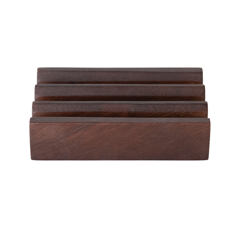 Side view of a dark, natural mango wood stand featuring three slotted sections on a white background.