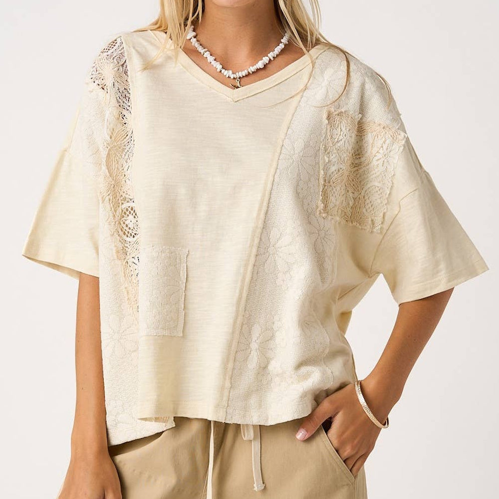 Natural patchwork lace V-neck short sleeve top in cream with boho floral embroidery and a relaxed fit.