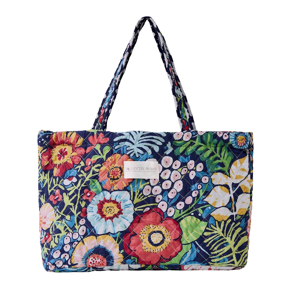 Quilted Levtex Home tote bag featuring a vibrant floral garden pattern with red, blue, and yellow flowers on navy.