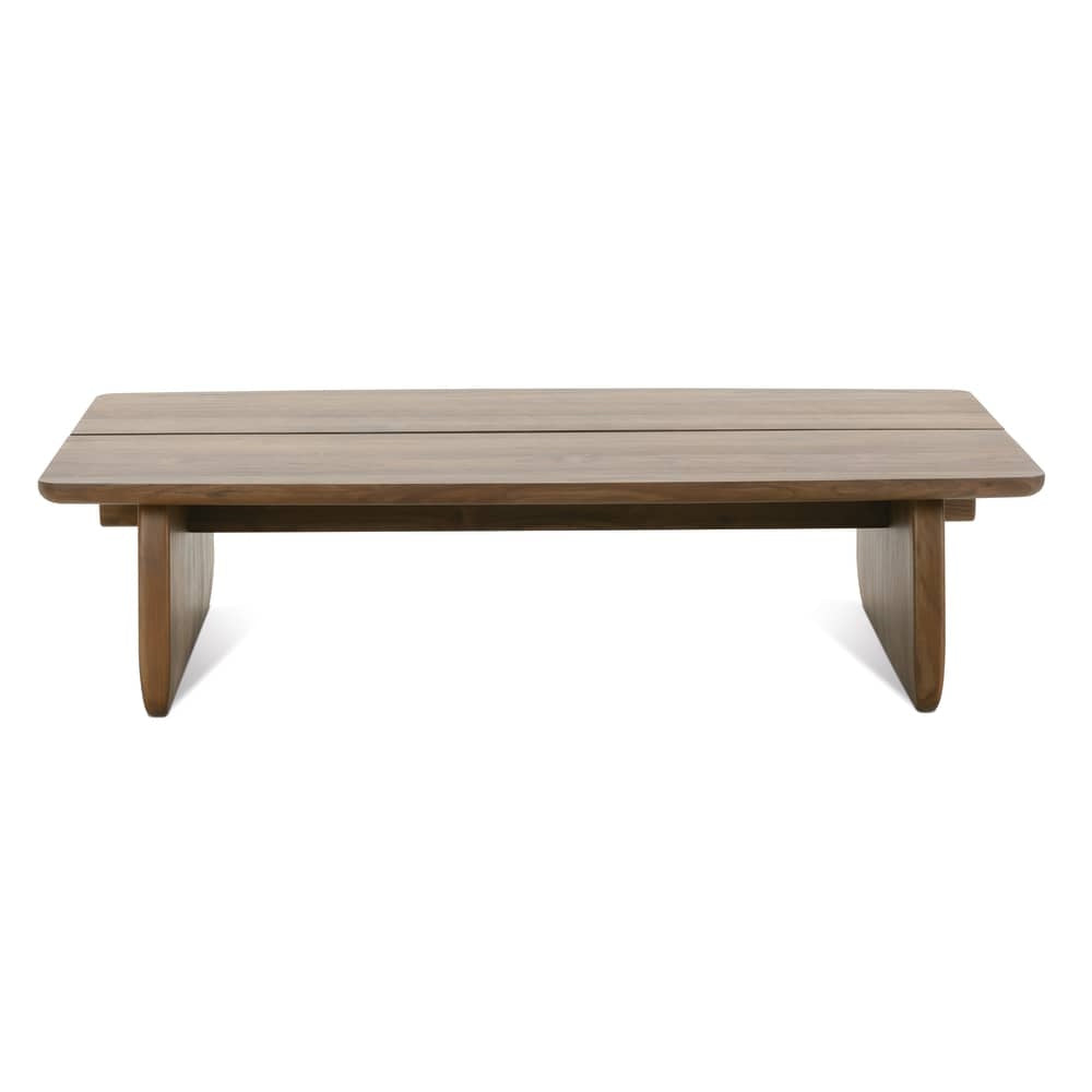 Front view of modern walnut cocktail table with rounded rectangular top, sculptural panel legs and minimalist design.