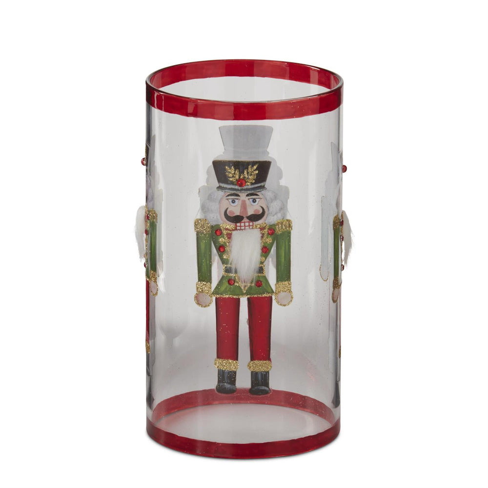 Glass candle slip cover featuring a traditional nutcracker design.