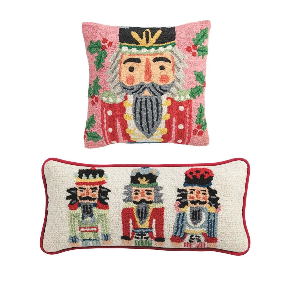 Two wool hook pillows featuring nutcracker designs against a white background.