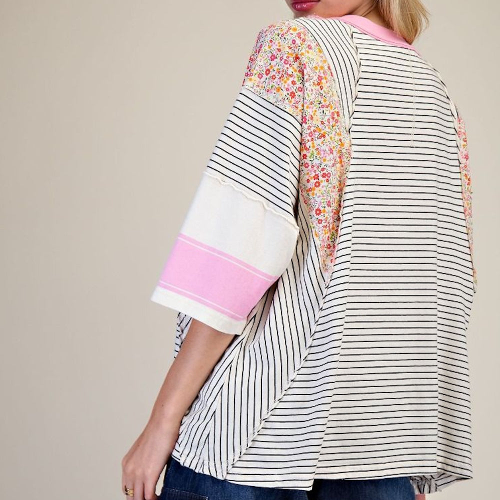 Oat black striped mixed print mineral washed knit top featuring floral shoulder panels and pink sleeve detail.