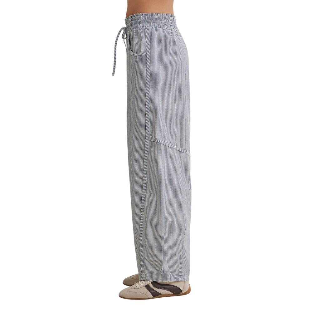 Side profile of blue and white striped barrel-leg pants with an elastic drawstring waist and side seams.