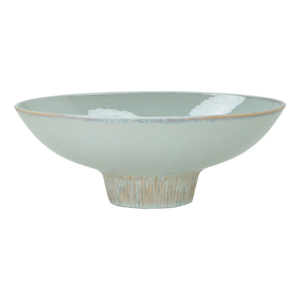Light mint green glazed ceramic bowl with a textured, ridged pedestal base on a white background.