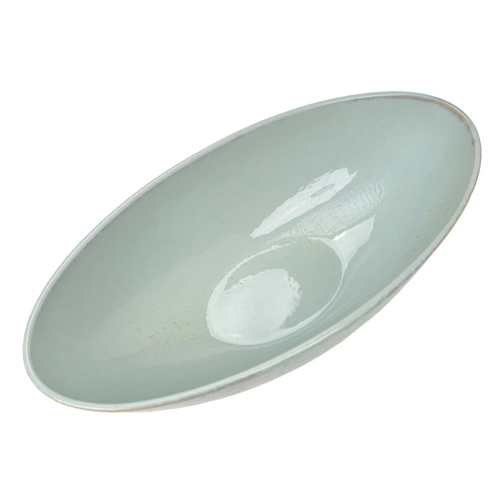 Top-down view of an elongated oval ceramic serving bowl in smooth, glossy light sage green.
