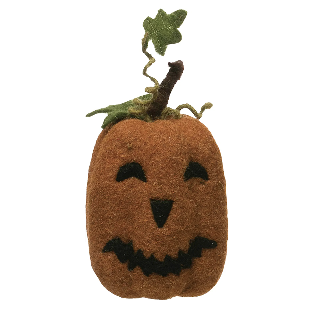 Orange felt jack-o'-lantern decoration with black face features, stem, and green leaves.
