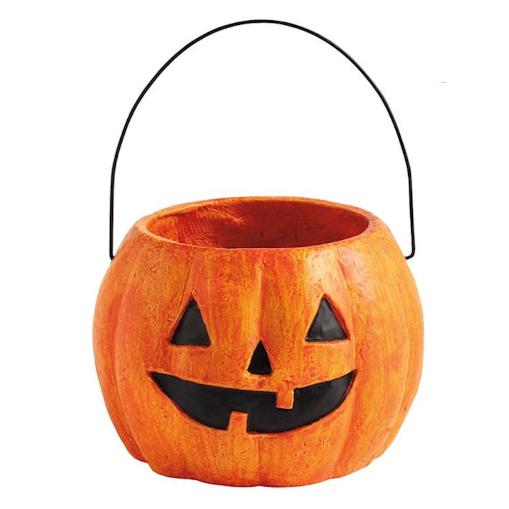 Miniature orange paper mache jack-o'-lantern bucket with a black wire handle and painted face for Halloween.