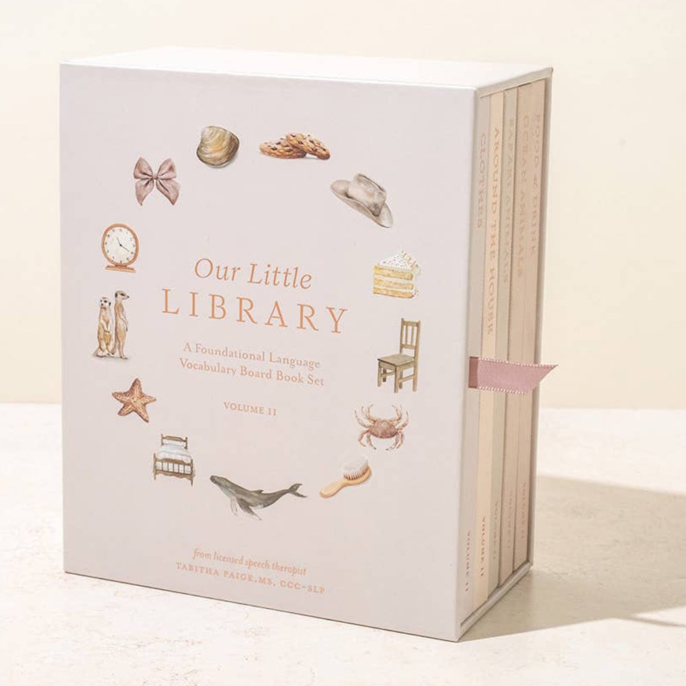 Our Little Library Volume II board book box set featuring watercolor illustrations of animals, food, and household objects.