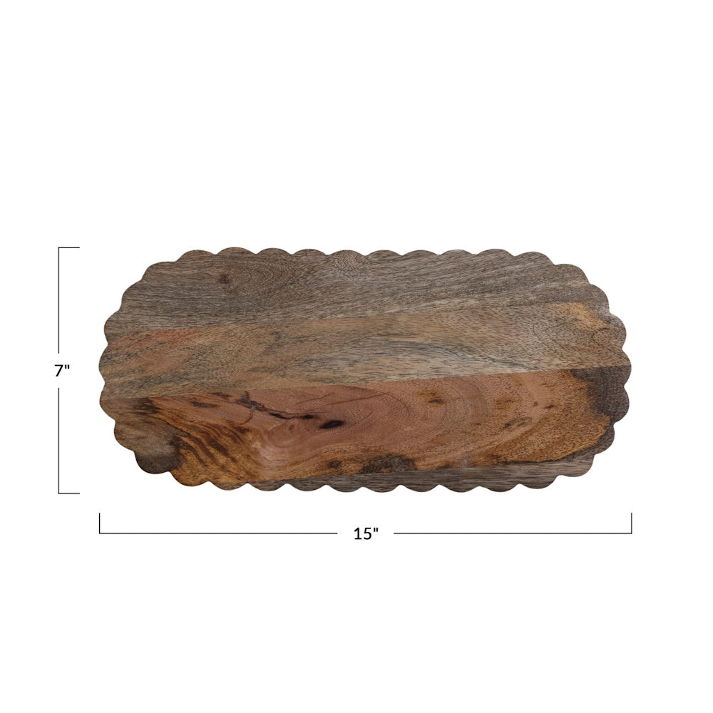 Oval scalloped wooden serving board with dimensions showing 15 inches long by 7 inches wide.
