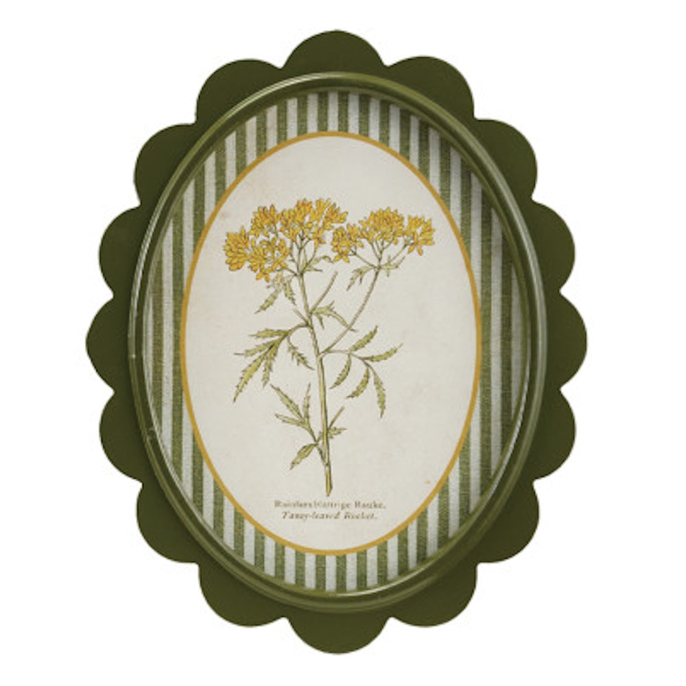 Green scalloped oval frame with yellow botanical flower art on a green striped mat for cottagecore wall decor.