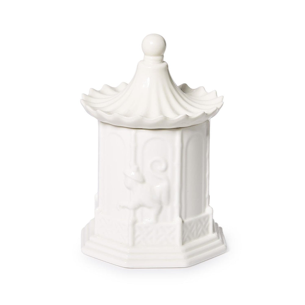 White ceramic pagoda-shaped jar with lid against a plain background.