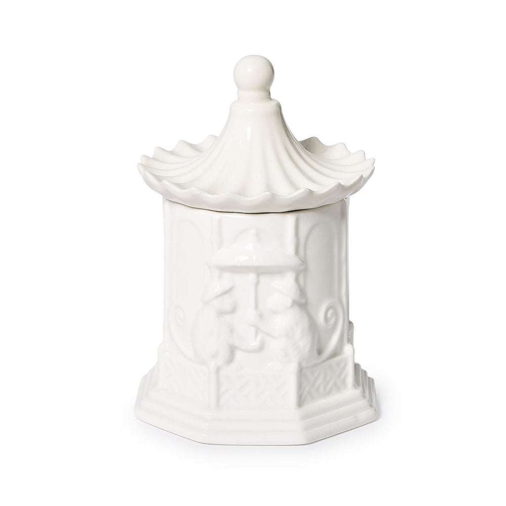 White ceramic pagoda-shaped jar with embossed details and a finial lid.