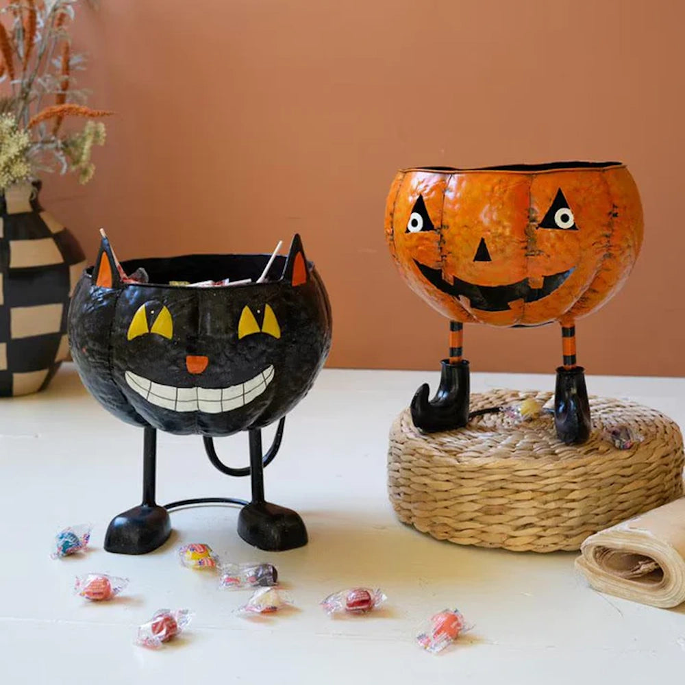 Halloween jack-o'-lantern and black cat metal candy bowls with legs.