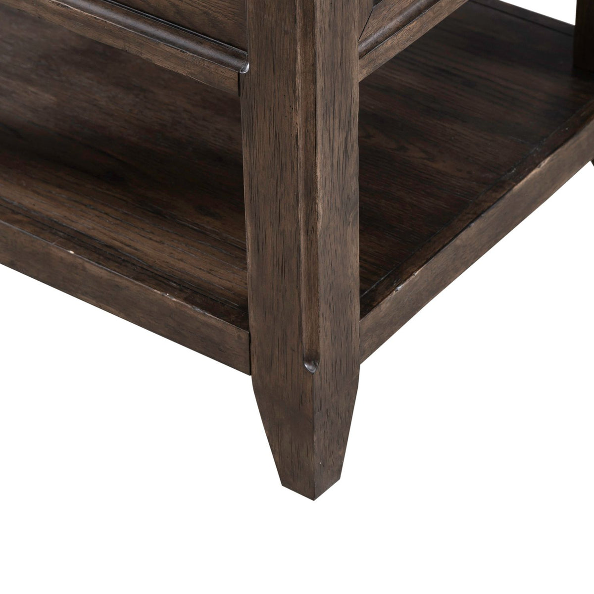Close up of dark wood end table leg and lower shelf showcasing rustic grain texture and sturdy construction.