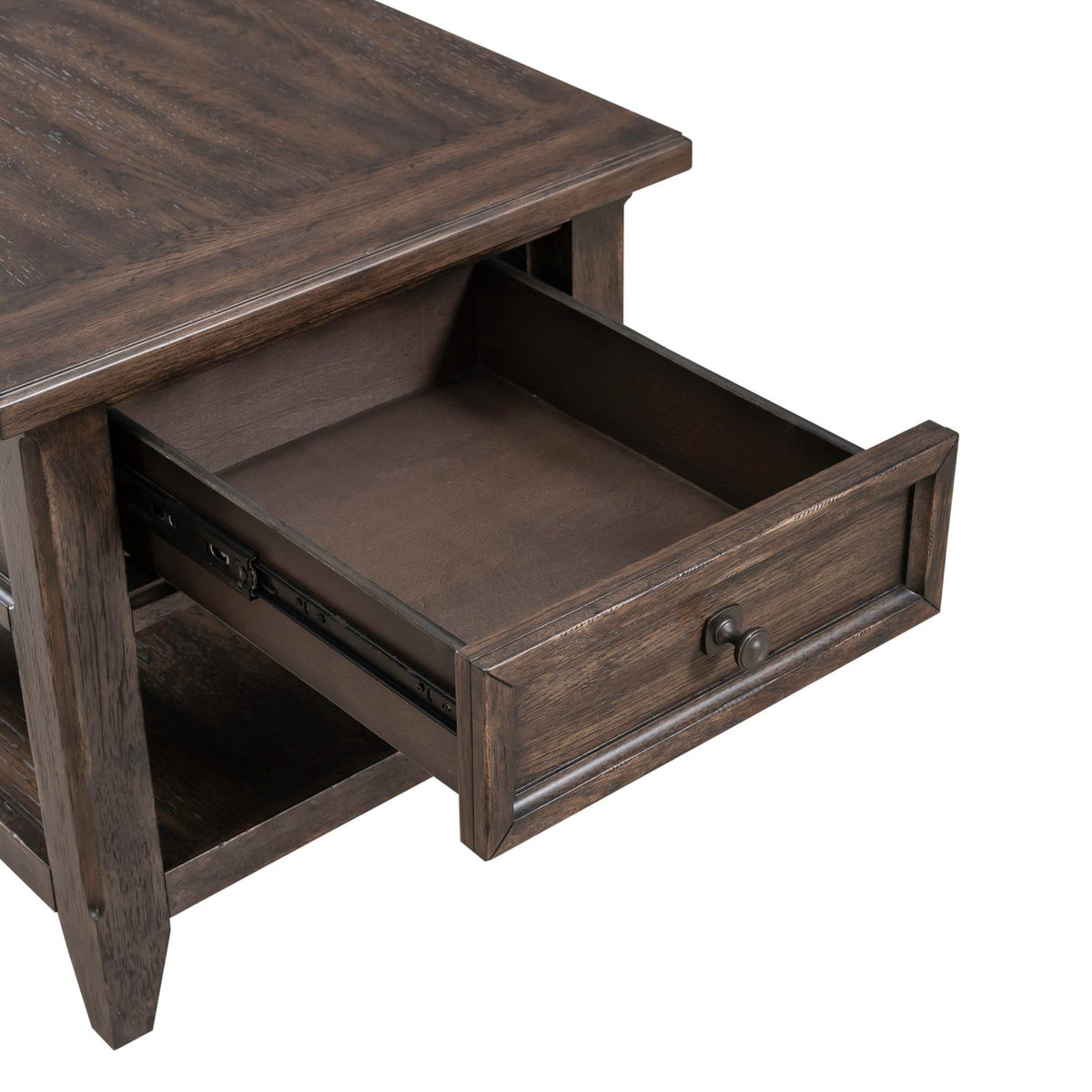 Close up of dark wood end table with open storage drawer, framed front panel and smooth glide hardware.
