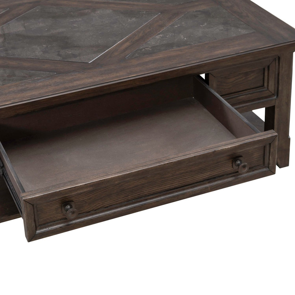 Close up of rustic dark wood coffee table drawer with spacious storage and decorative framed front panel design.