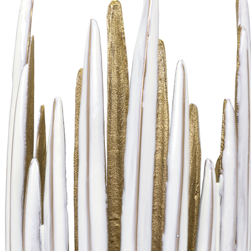 Close-up of modern Parco tall candleholder featuring abstract white and gold textured vertical spikes.