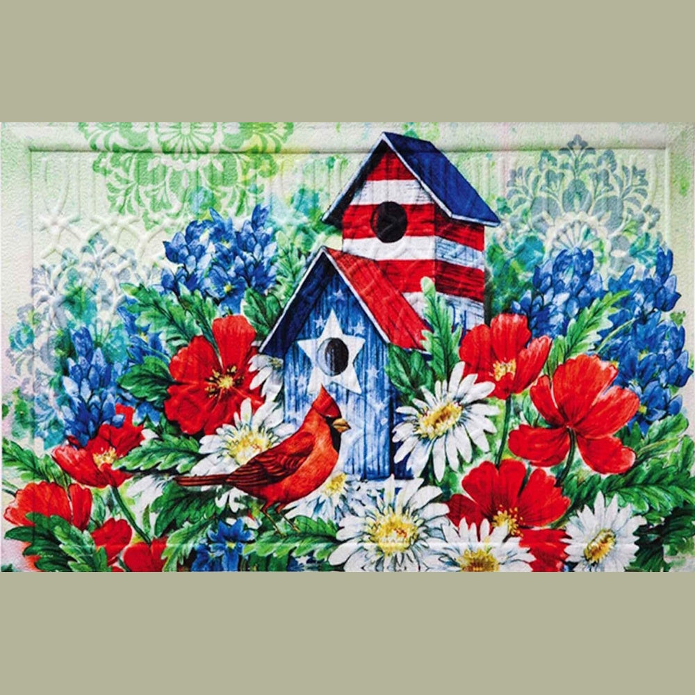 Red cardinal perched among red poppies, daisies, and blue flowers near patriotic American flag birdhouses.